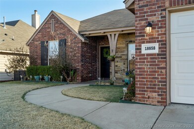 Full Brick exterior with sidewalk, covered patio a