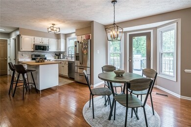 Choice of the eat in kitchen or the kitchen stools.  New lighting and huge windows make this area bright and cheerful.