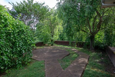 Your own private oasis right off your front porch. How nice would a bench be...