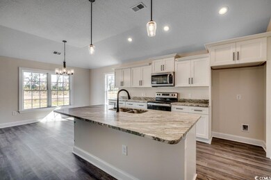 Kitchen with appliances with stainless steel finis