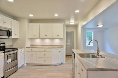 Wow! Open and bright new kitchen with island featu