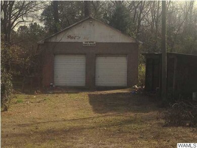 Shop- small covered sheds to the right