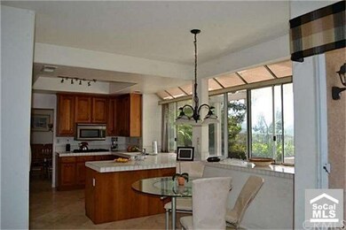 Over sized Kitchen with bright open eating area