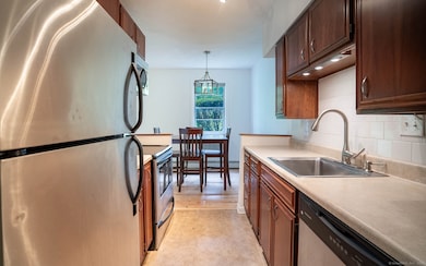 Stainless steel appliances and cherry cabinets