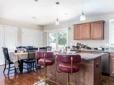 Eat-in kitchen with gleaming granite and plenty of