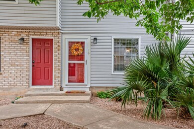 Entrance to property with brick siding