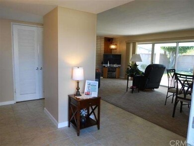Bulky , paneled coat closet removed which enhanced