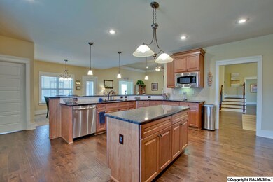 Huge kitchen with island and tons of granite counter space.