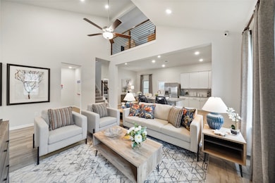 The large family room opens to a well-appointed kitchen and breakfast room perfect for honing your culinary skills and enjoying delicious meals together.