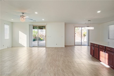 Unfurnished living room with a wealth of natural l