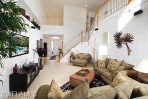 Living room featuring a high ceiling