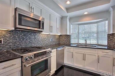 Gourmet chef's kitchen with full granite counters,