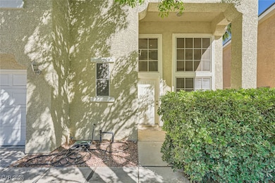 Property entrance with stucco siding