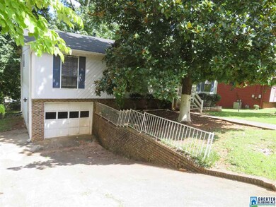 A sloped driveway provides an entrance into the 1-