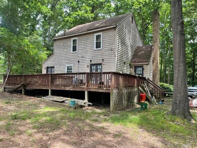 Rear view of house with a deck