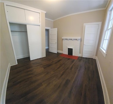 Unfurnished bedroom with ornamental molding, baseb