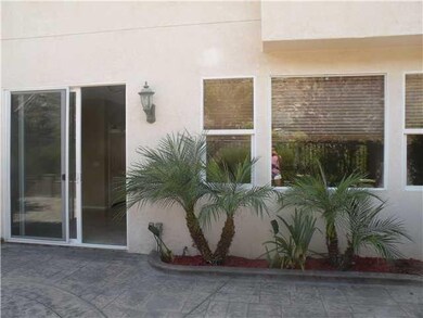 THE ENTIRE REAR OF HOME  IS WELL LIT FROM MULTIPLE WINDOWS LOOKING OUT TO PRIVATE PATIO AND HILLSIDE VIEWS