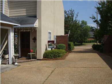 The garage is in the back of the home.