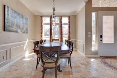 A great deal of natural sunlight makes this formal dining room light and bright.