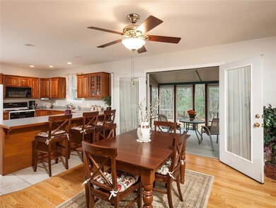 The spacious eat-in kitchen opens...