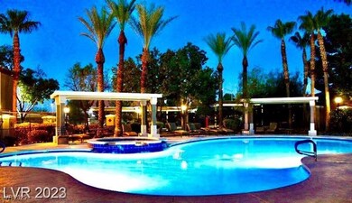 View of pool featuring a patio and a pool with connected hot tub