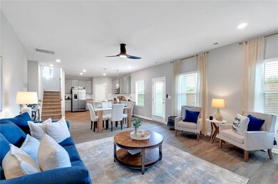 Living area with visible vents, light wood-type fl