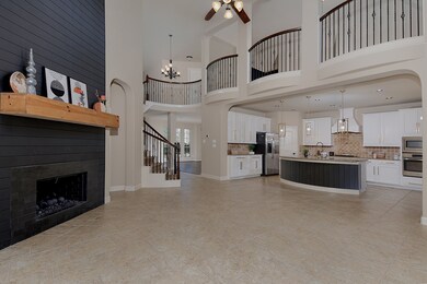 The family room has 2-story ceiling with views of