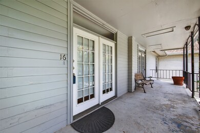 a cozy balcony with French doors leading outside.