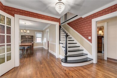 Make your entrance through the french doors to a 12' x 7' foyer w/ hardwood floors and chandelier.