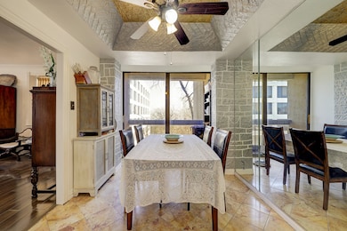 Large breakfast room with an accent mirror opens t