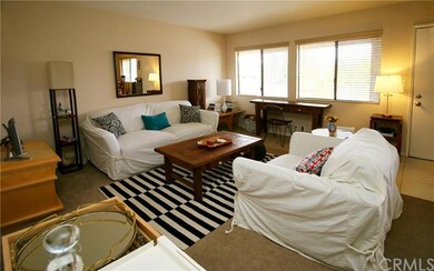 Spacious living room with view of hills, and a sto