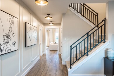 Entryway featuring wood finished floors and stairs