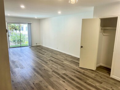 Living area showing one of the entry hall closets