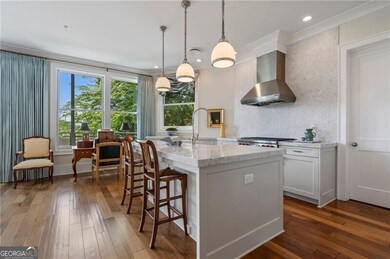 Chef's kitchen with top of the line appliances and upgraded marble countertops