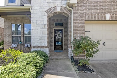 Leaded glass door and front porch.  Great curb appeal !