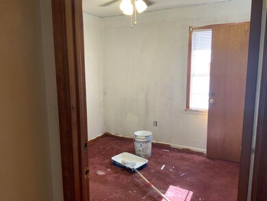 Carpeted bedroom with baseboards and ceiling fan