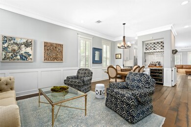 Formal living boasts custom wainscoting.