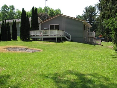Side/rear showing deck and yard.
