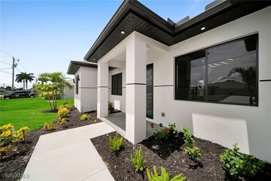 View of side of property featuring a yard