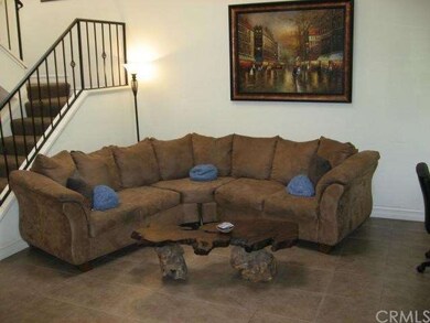 Living room open to dining and kitchen areas