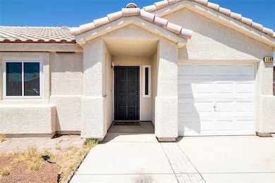 Doorway to property featuring a tile roof, stucco