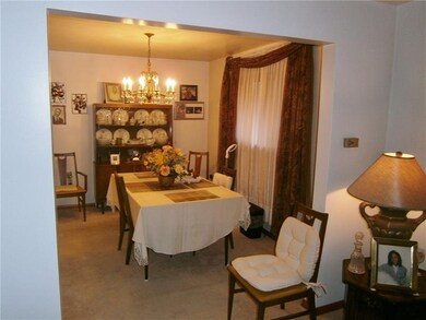 LOOKING INTO THE DINING ROOM FROM THE LIVING ROOM
