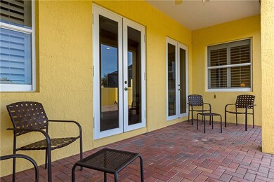 Covered area with doors to the sitting room.