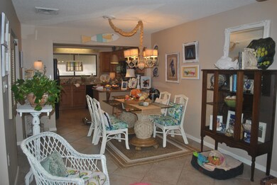 Dining area with light tile patterned floors and a