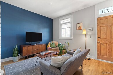 Living room featuring wood flooring