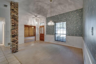 Large dining area with light tile patterned floors and neutral carpets
