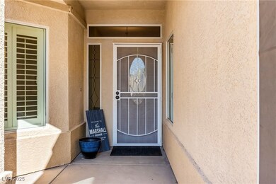 View of exterior entry featuring stucco siding