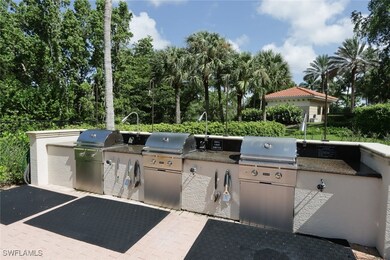 View of patio with a grill and area for grilling