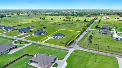 Birds eye view of property with a rural view