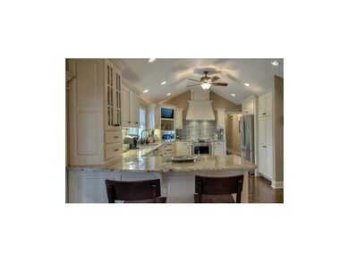 Gleaming granite, subway tile, vaulted ceiling, un